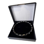 Men's hematite bracelet with dark metallic square beads on tattooed wrist