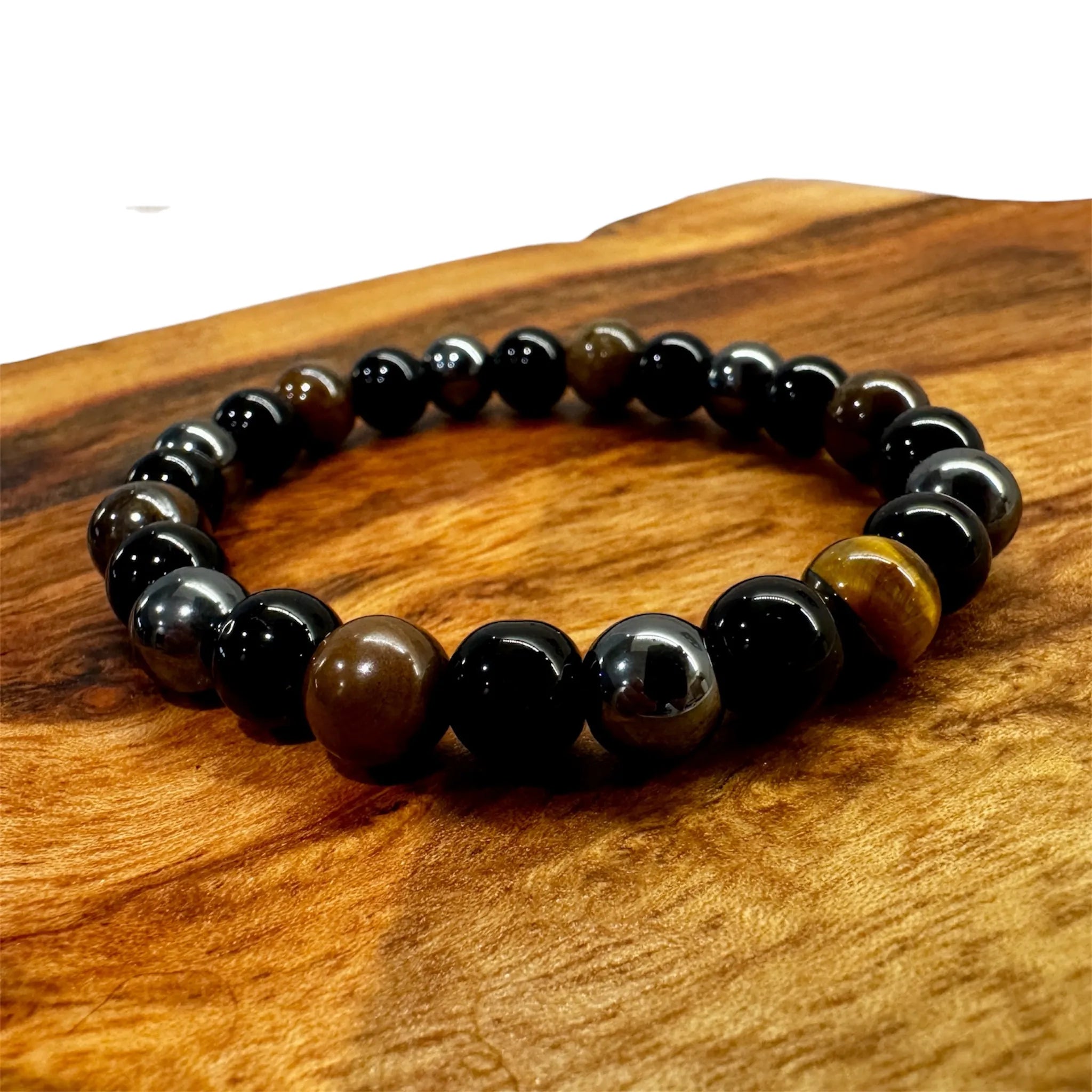Men's triple gemstone protection bracelet on wrist